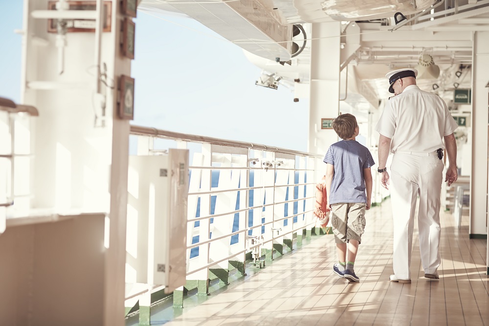 boy and captain on cruise ship