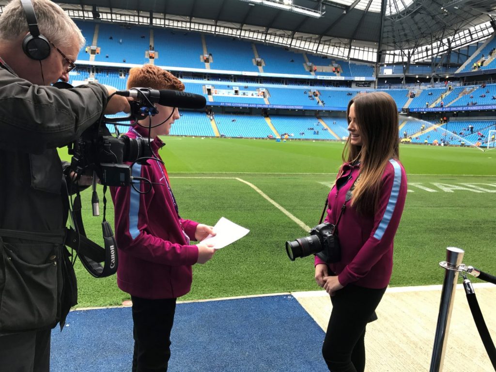 photographer interview at football stadium