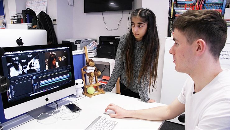 man and girl at computer