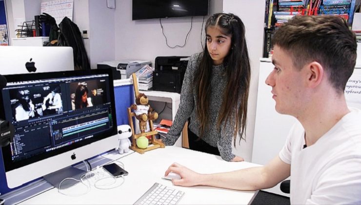 Man and girl at computer